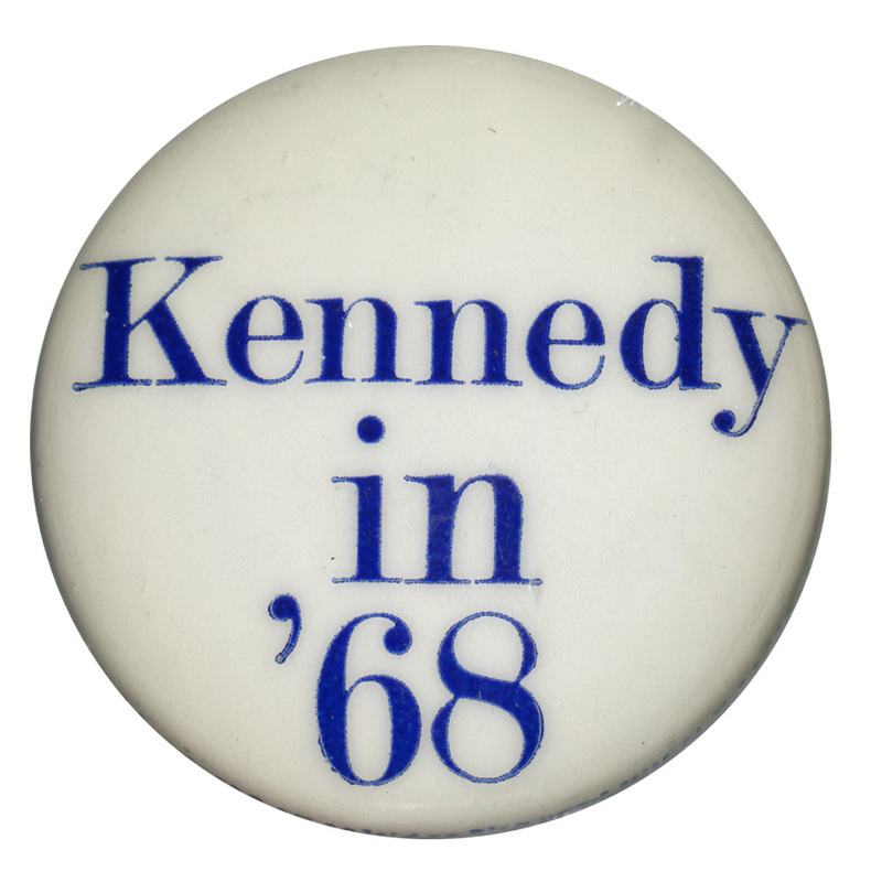 Round, white button with blue text reading "Kennedy in '68." 