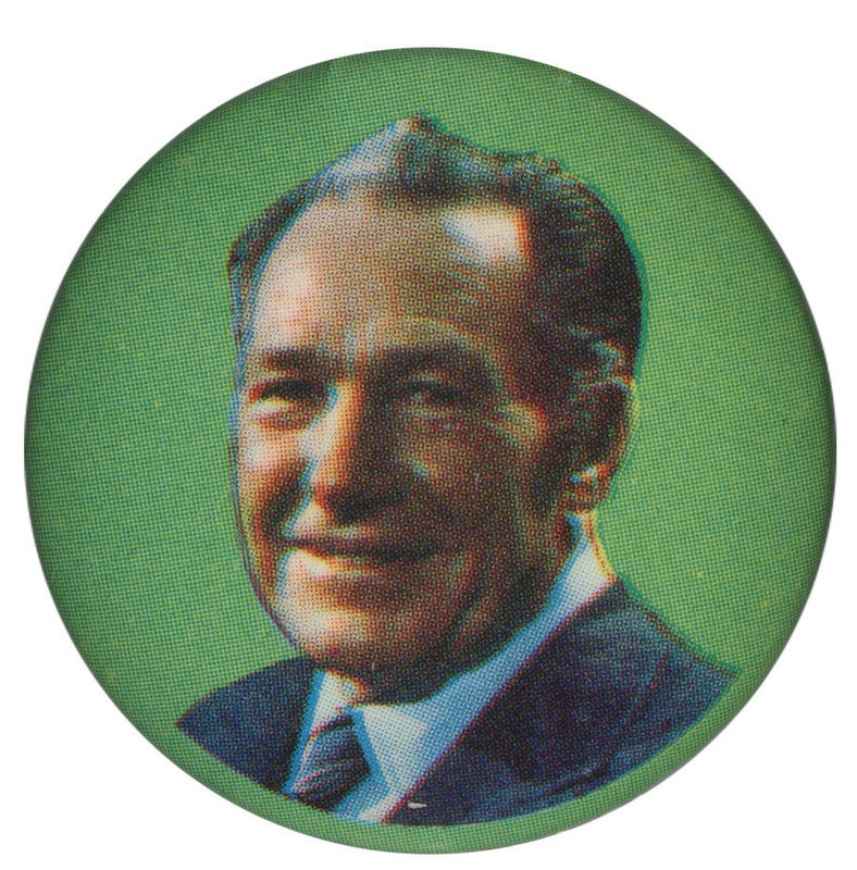 Round, green button with a color portrait of Sam Yorty.