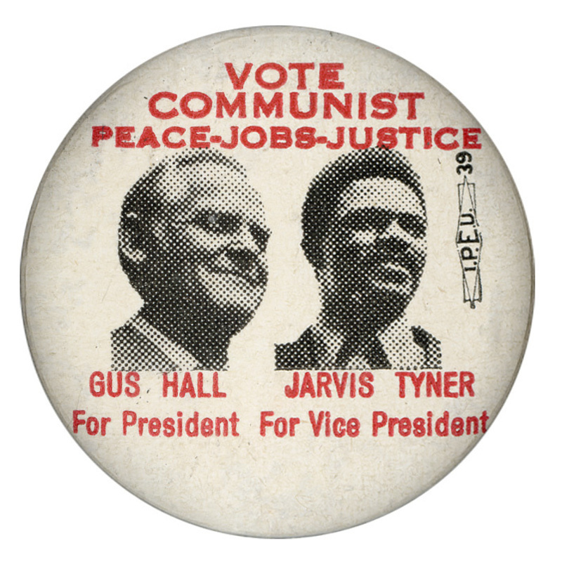Round, white button with black and white portraits of Gus Hall and Jarvis Tyner. Red text reads "Vote Communist, Peace-Jobs-Justice, Gus Hall For President, Jarvis Tyner for Vice President."
