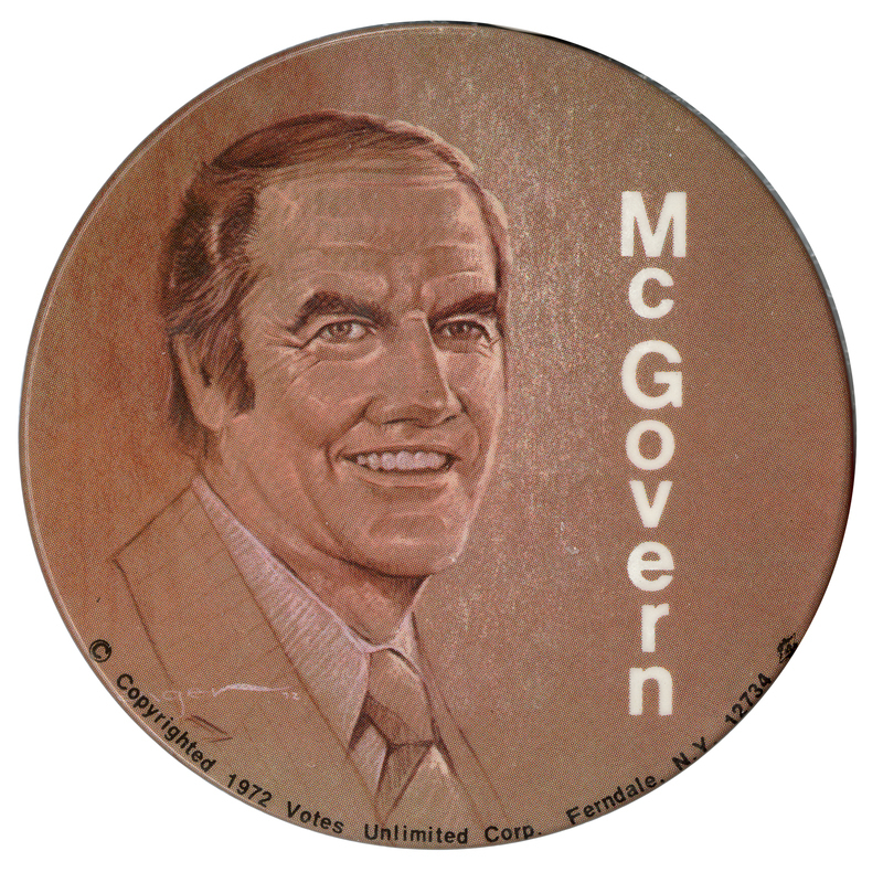 Round, brown button with a brown and white drawing of George McGovern and white text reading "McGovern"