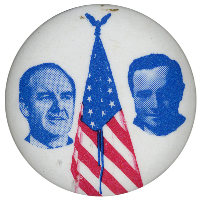 Round, white button with blue portraits of George McGovern and Thomas Eagleton and a drawing of the US flag.