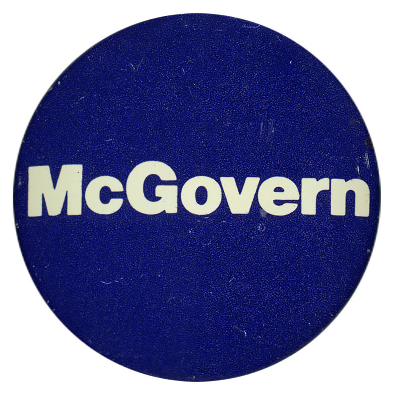 Round, black button with white text reading "McGovern"