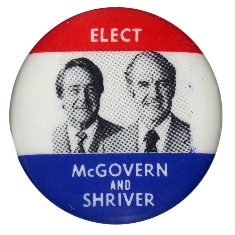 Round button with red, white, and blue bands and portraits of George McGovern and Sargent Shriver. White text reads "ELECT McGOVERN AND SHRIVER"