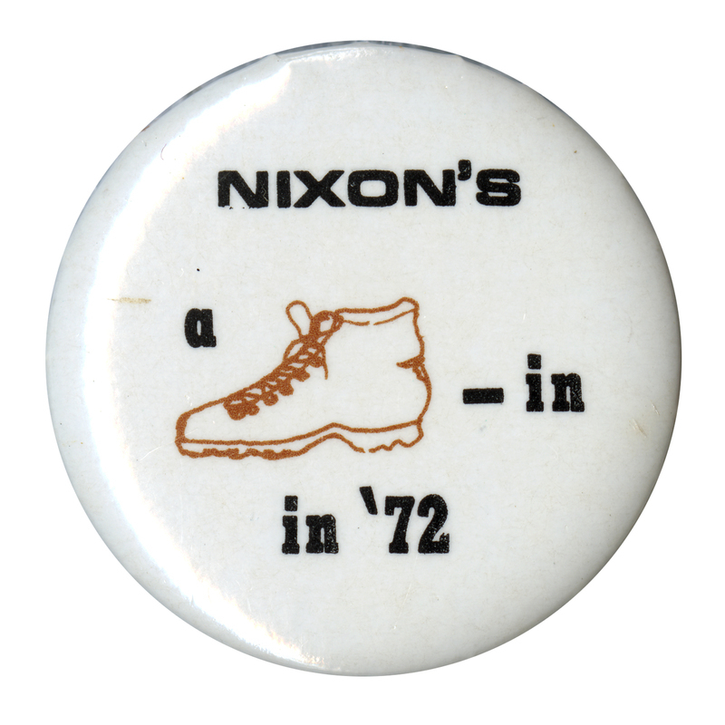 Round, white button with a drawing of a shoe. Black text reads "NIXON'S a [image of a shoe]-in in '72"