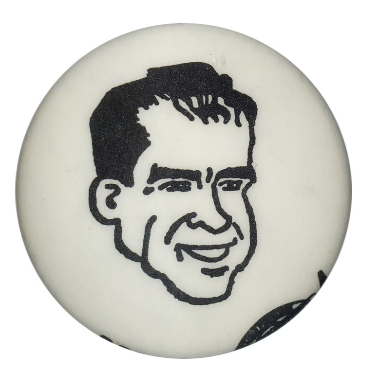 Round, white button with a black line drawing of Nixon's face.