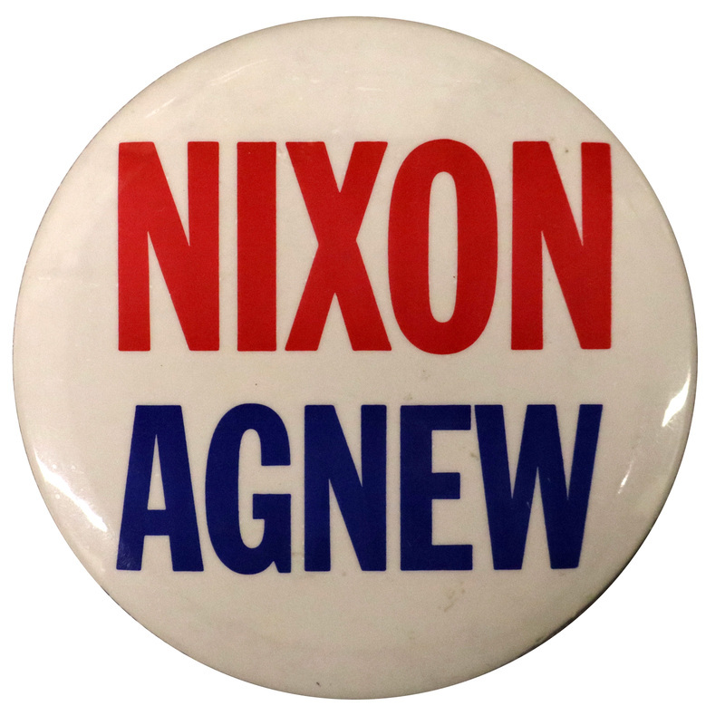 Round, white button with red and blue text reading "NIXON AGNEW"