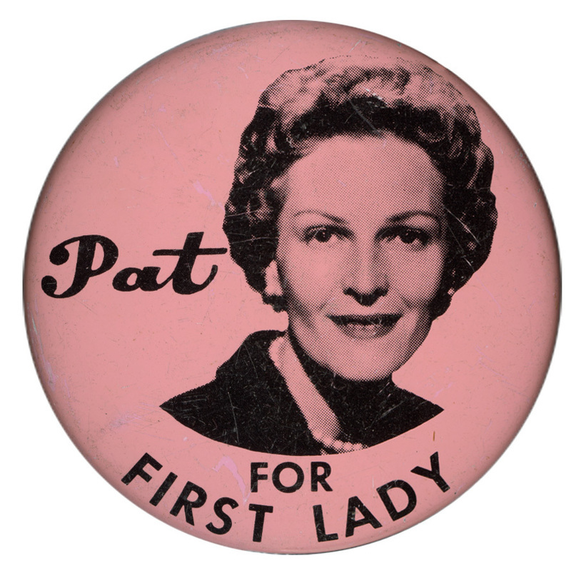 Round, pink button with a black and white portrait of Pat Nixon and black text reading "Pat FOR FIRST LADY"