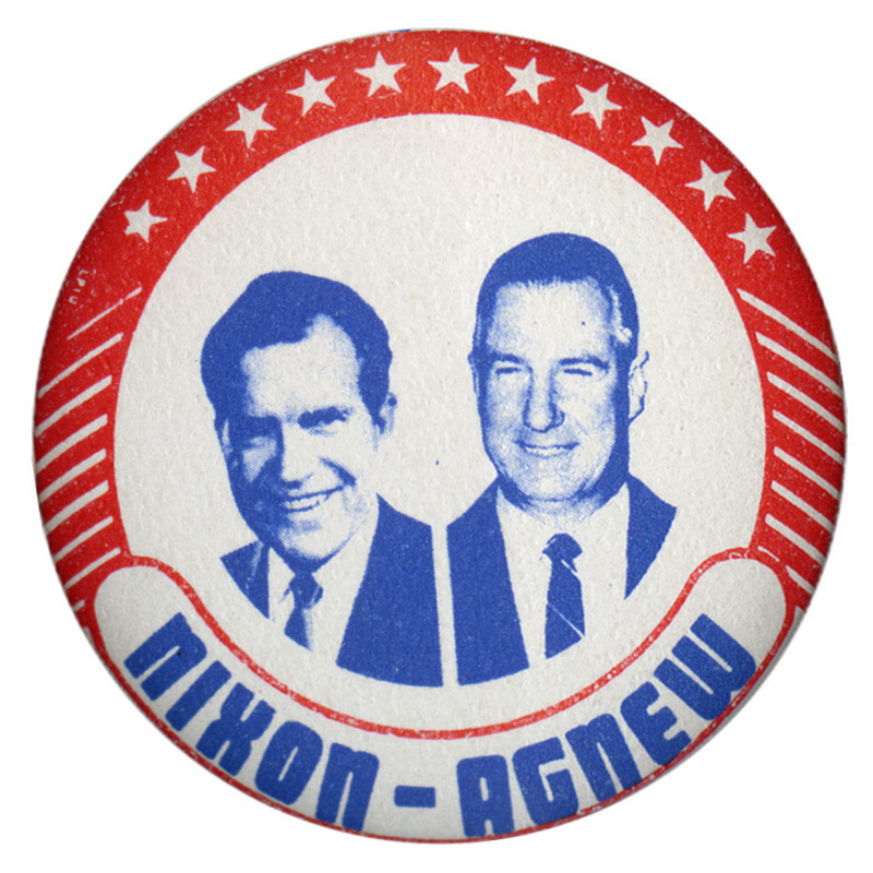 Round, white button edged in red stars and stripes surrounding blue portraits of Richard Nixon and Spiro Agnew. Blue text reads "NIXON-AGNEW"