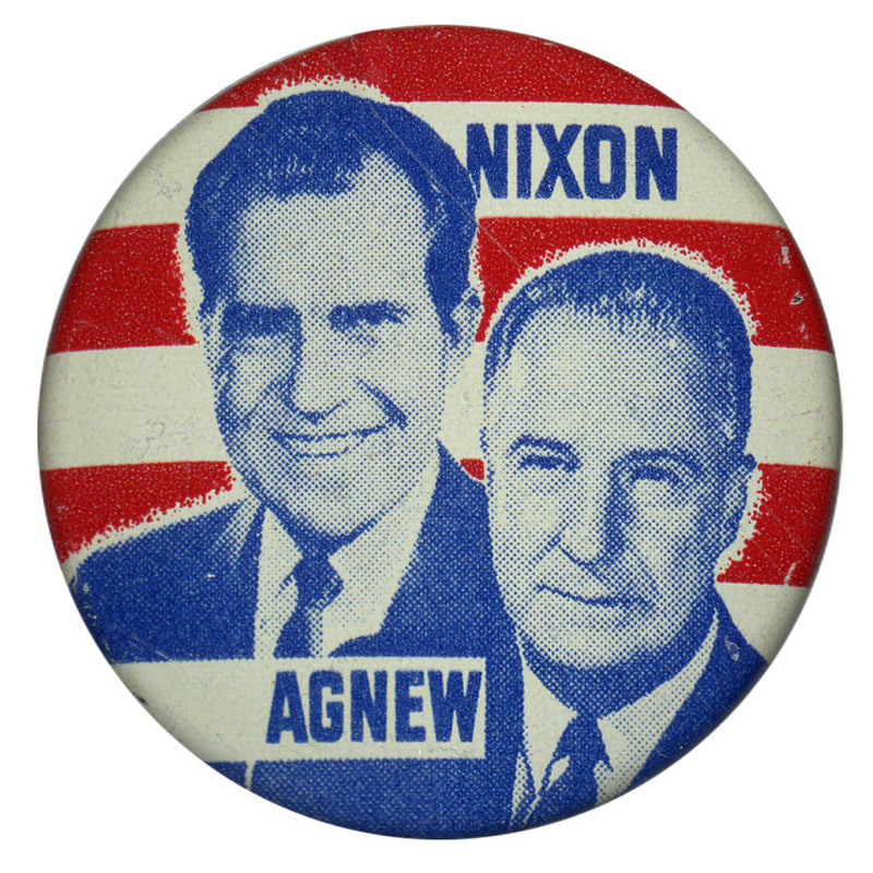 Round button with blue portraits of Richard Nixon and Spiro Agnew set against a background of red and white stripes. Blue text reads "NIXON AGNEW"