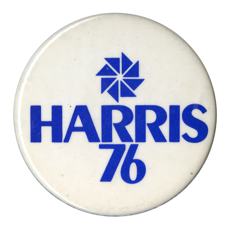 Round, white button with a drawing of a blue pinwheel and blue text reading "HARRIS 76"