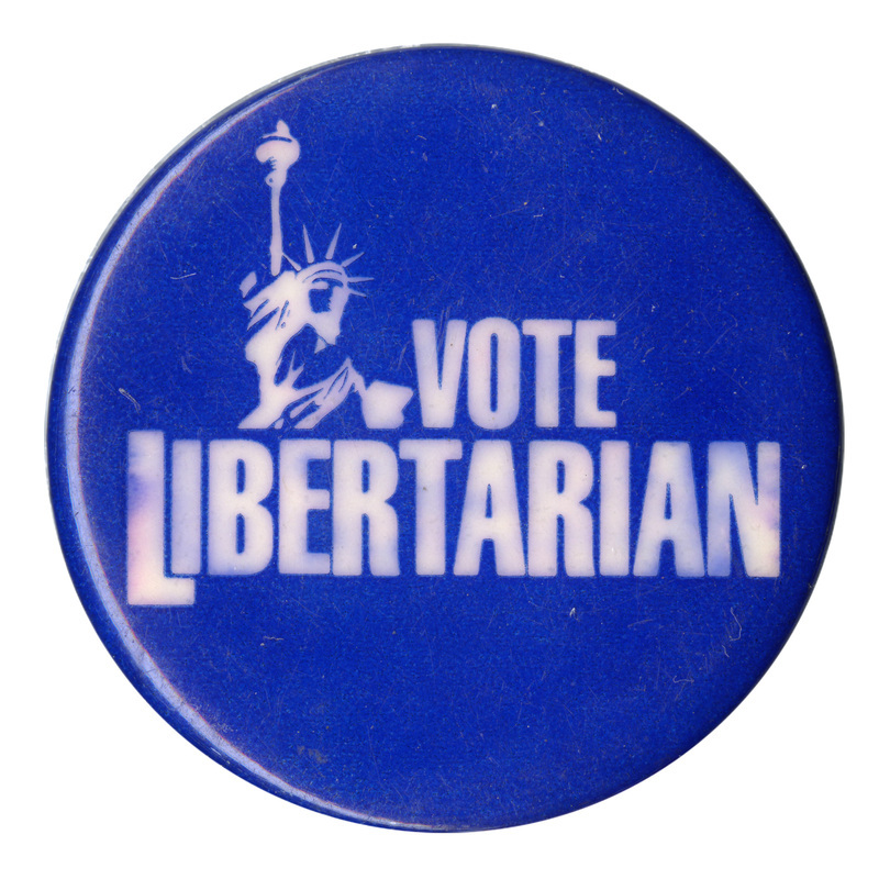Round, blue button with a white image of the Statue of Liberty and white text reading "VOTE LIBERTARIAN"