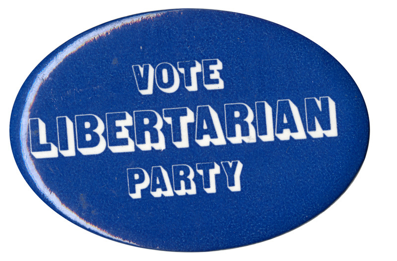 Oval, blue button with blocky, white text reading "VOTE LIBERTARIAN PARTY"