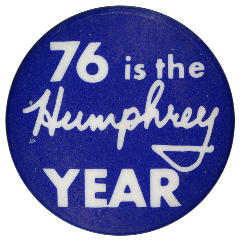 Round, blue button with white text reading "76 is the Humphrey YEAR"