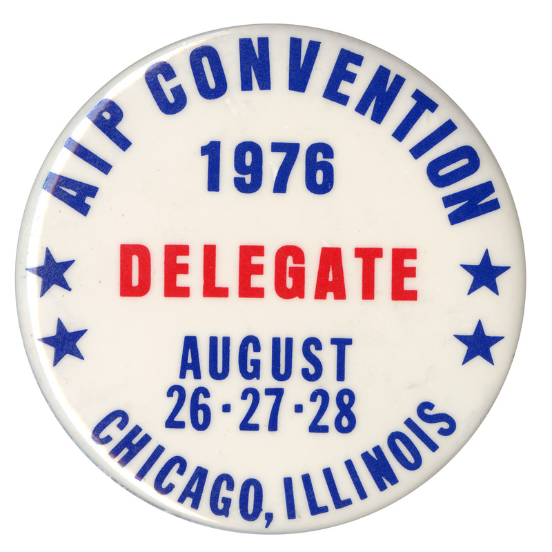 Round, white button with blue and red text reading "AIP CONVENTION 1976 DELEGATE AUGUST 26-27-28 CHICAGO, ILLINOIS"