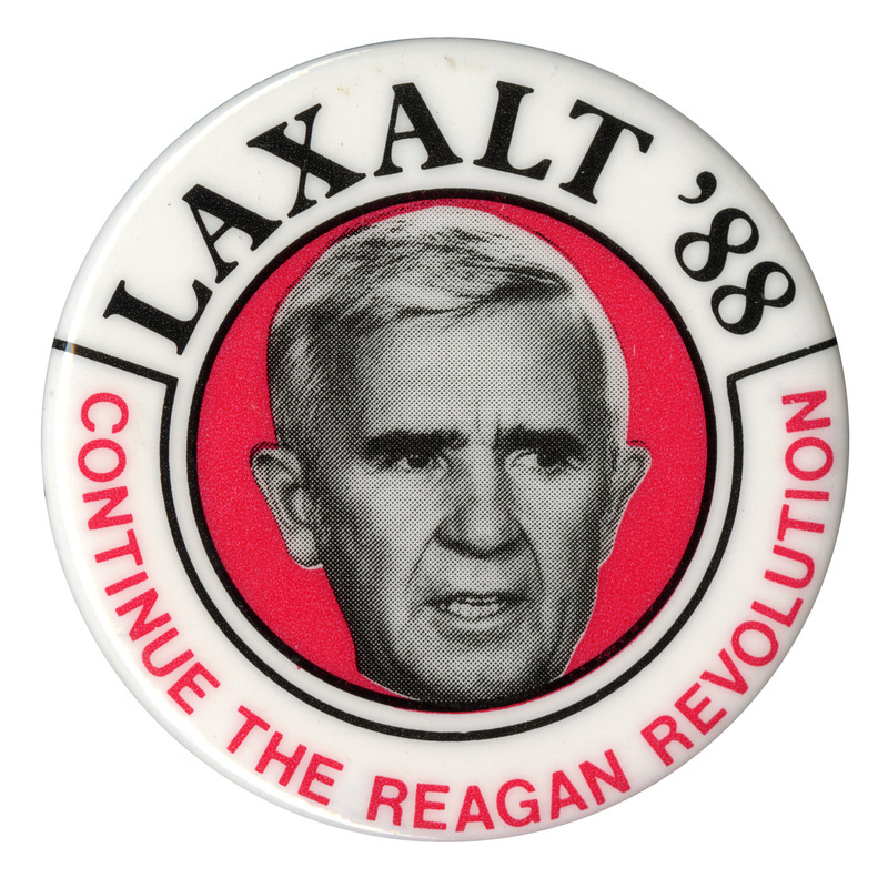 Round, white button with a black and white photograph of Paul Laxalt on a red circle in the center. Red and black text reads "LAXALT CONTINUE THE REAGAN REVOLUTION"