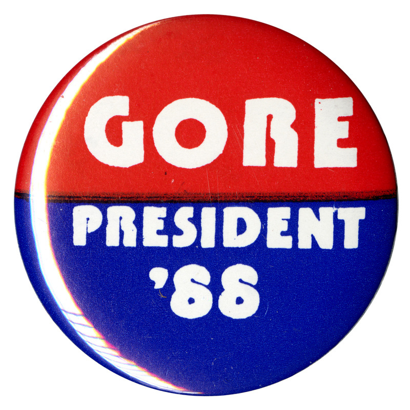 Round button with a red upper half and blue lower half. White text reads "GORE PRESIDENT '88"
