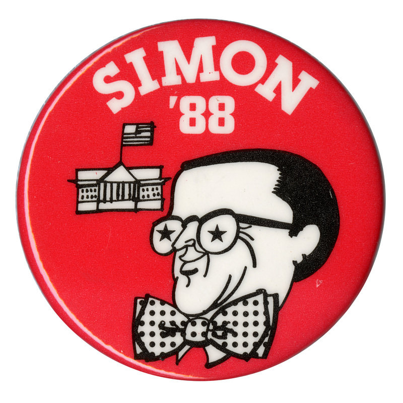 Round, red button with a black and white cartoon drawing of Paul Simon and the White House. White text reads "SIMON '88"