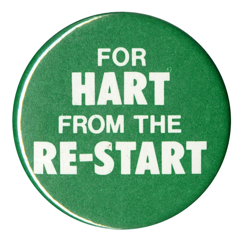 Round, green button with white text reading "FOR HART FROM THE RE-START"