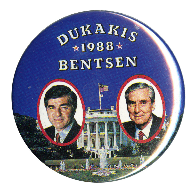 Round button with color photographs of Michael Dukakis and Lloyd Bentsen against a color photograph of the White House. White text reads "DUKAKIS 1988 BENTSEN"