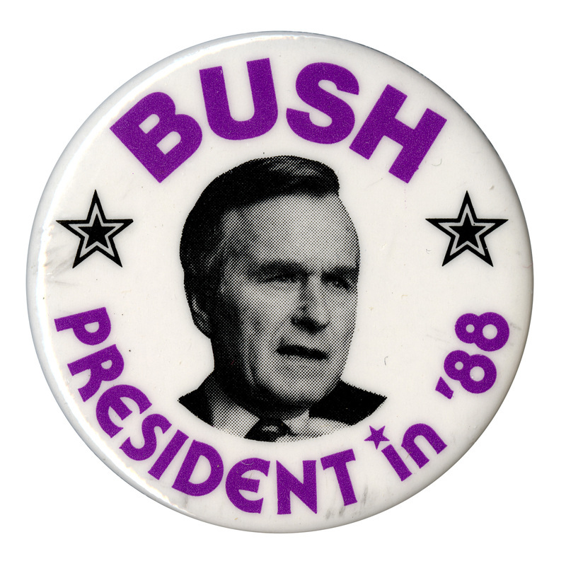 Round, white button with a black and white photograph of George H. W. Bush. Purple text reads "BUSH PRESIDENT in '88"