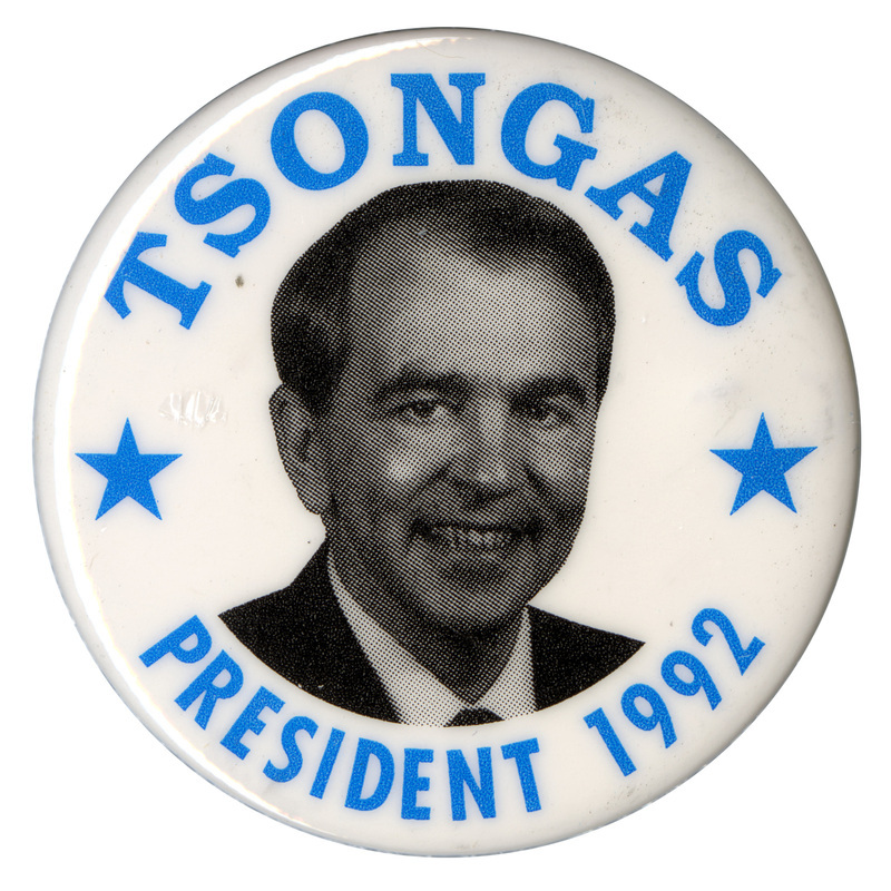 Round, white button with a black and white photograph of Paul Tsongas and blue text reading "TSONGAS PRESIDENT 1992"