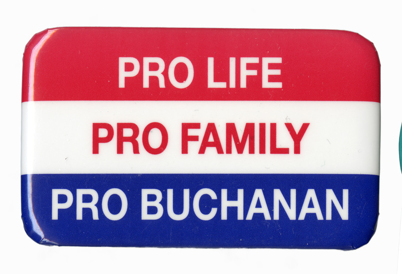Rounded rectangular button with bands of red, white, and blue. White and red text reads "PRO LIFE PRO FAMILY PRO BUCHANAN"