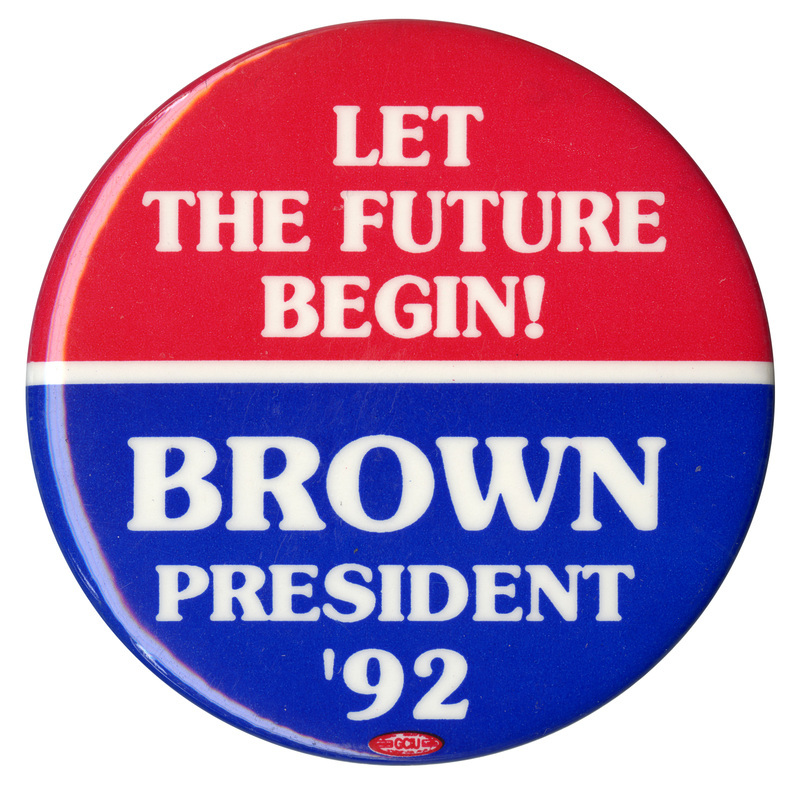 Round button with a red upper half and blue lower half. White text reads "LET THE FUTURE BEGIN! BROWN PRESIDENT '92"