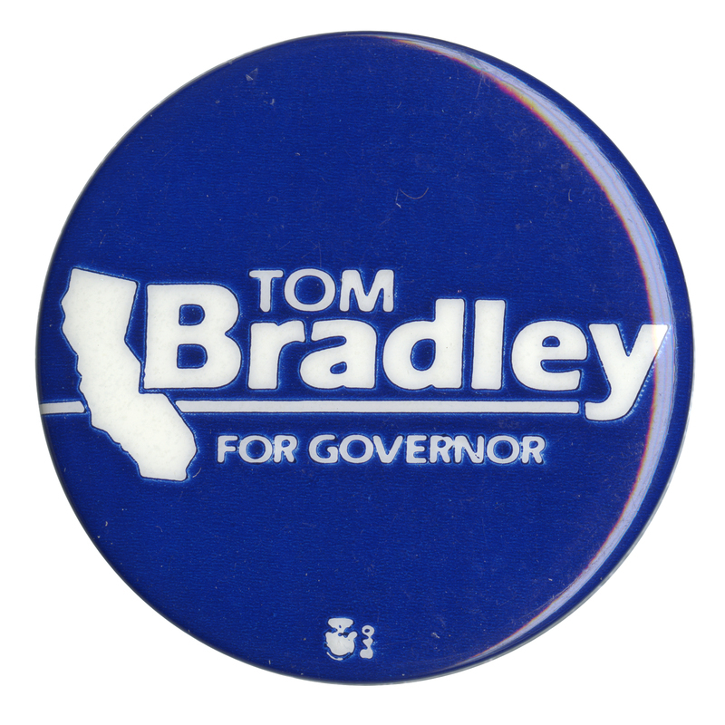 Round, blue button with a white outline of the state of California and white text reading "TOM Bradley FOR GOVERNOR"
