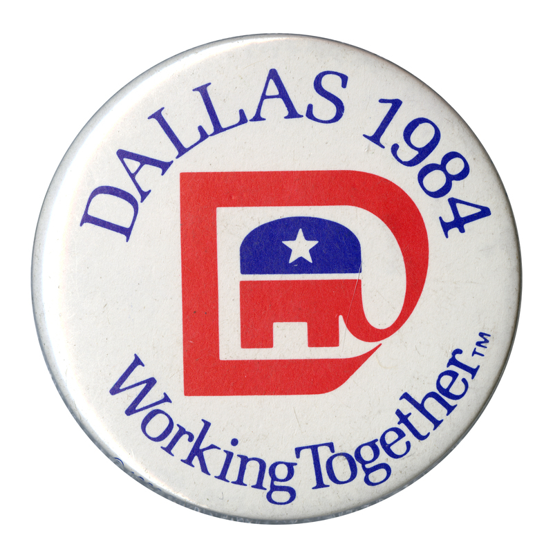 Round, white button with the GOP elephant symbol whose trunk is extended into a "D" shape. Blue text reads "DALLAS 1984 Working Together TM"