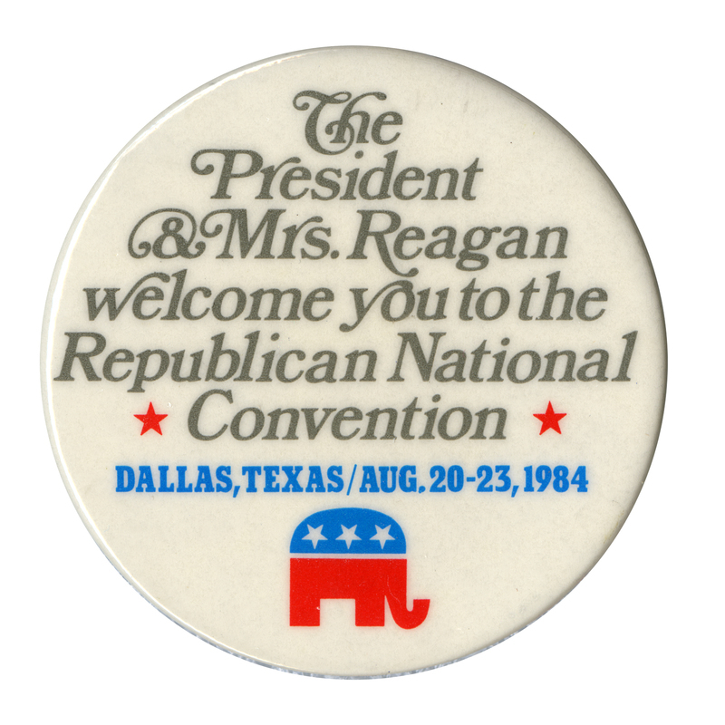 Round, white button with the GOP elephant symbol in red and blue. Gray and blue text reads "The President & Mrs. Reagan welcome you to the Republican National Convention DALLAS, TEXAS/AUG. 20-23, 1984"