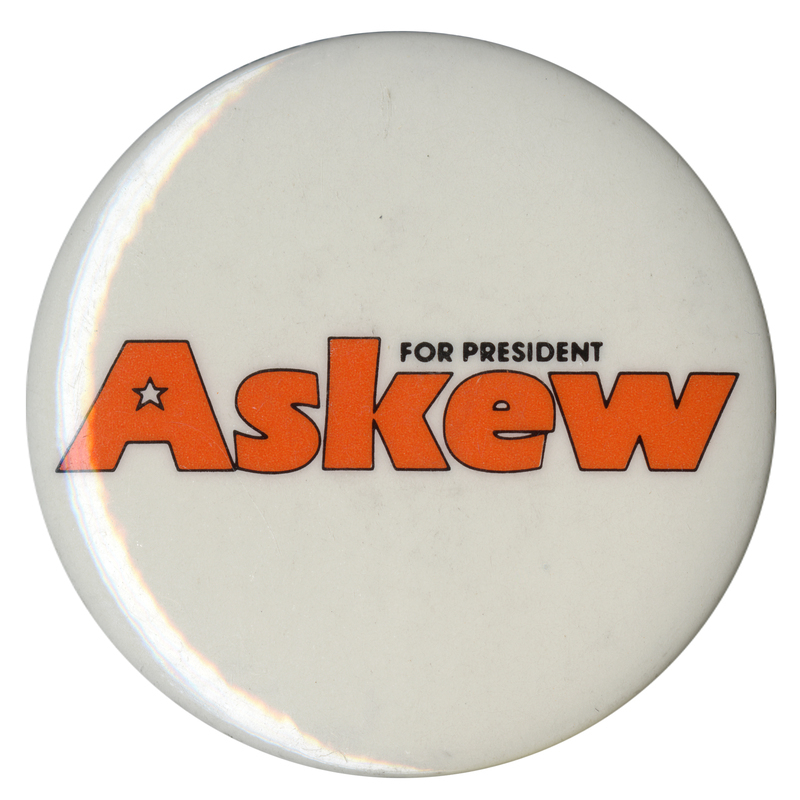 Round, white button with black and orange text reading "Askew FOR PRESIDENT"