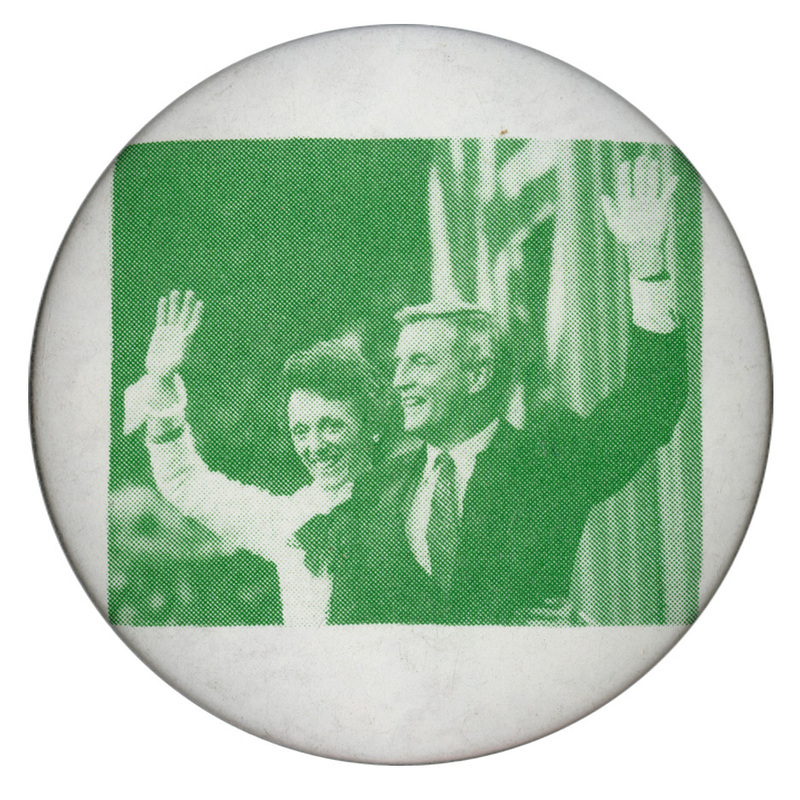 Round, white button with a green and white photograph of Joan and Walter Mondale.
