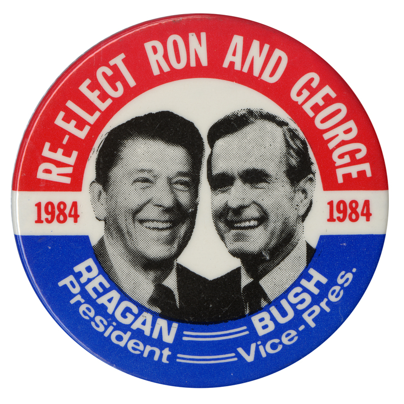 Round button with a red and blue border and black and white photographs of Ronald Reagan and George H. W. Bush. White text reads "RE-ELECT RON AND GEORGE 1984 REAGAN President BUSH Vice-Pres."