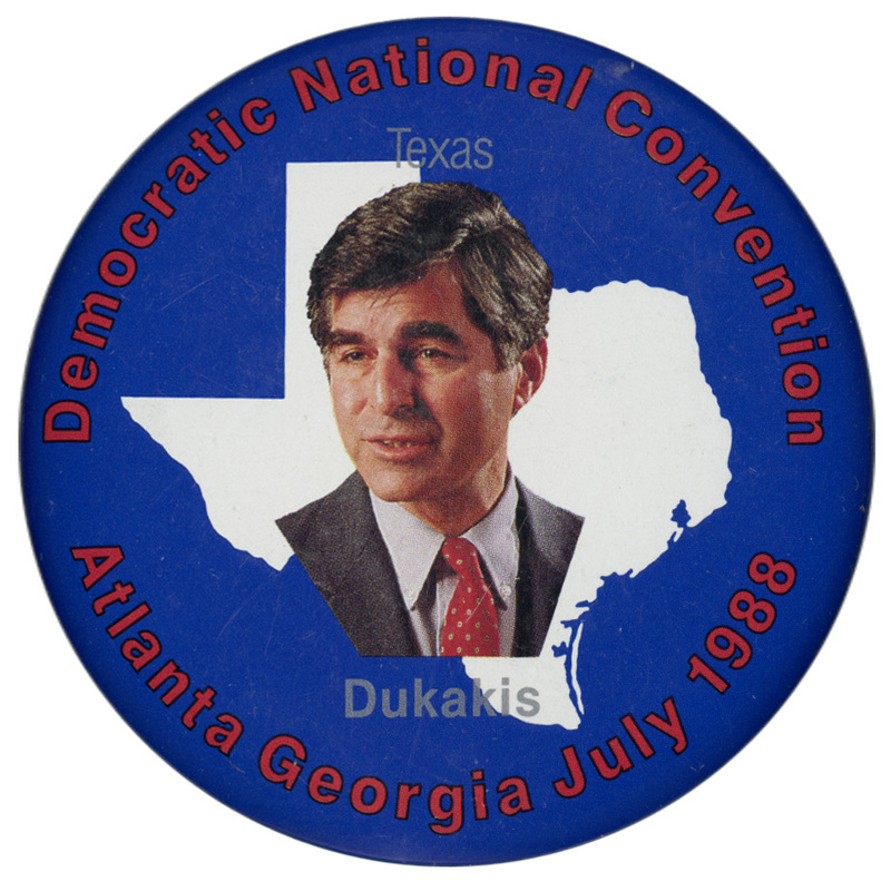 Round, blue button with a color photograph of Michael Dukakis against a white outline of the state of Texas.