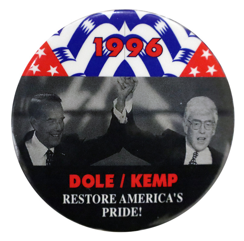 Round button with sections of red, white, and blue; black; and a black and white photograph of Bob Dole and Jack Kemp. Red and white text reads "1996 DOLE/KEMP RESTORE AMERICA'S PRIDE!"