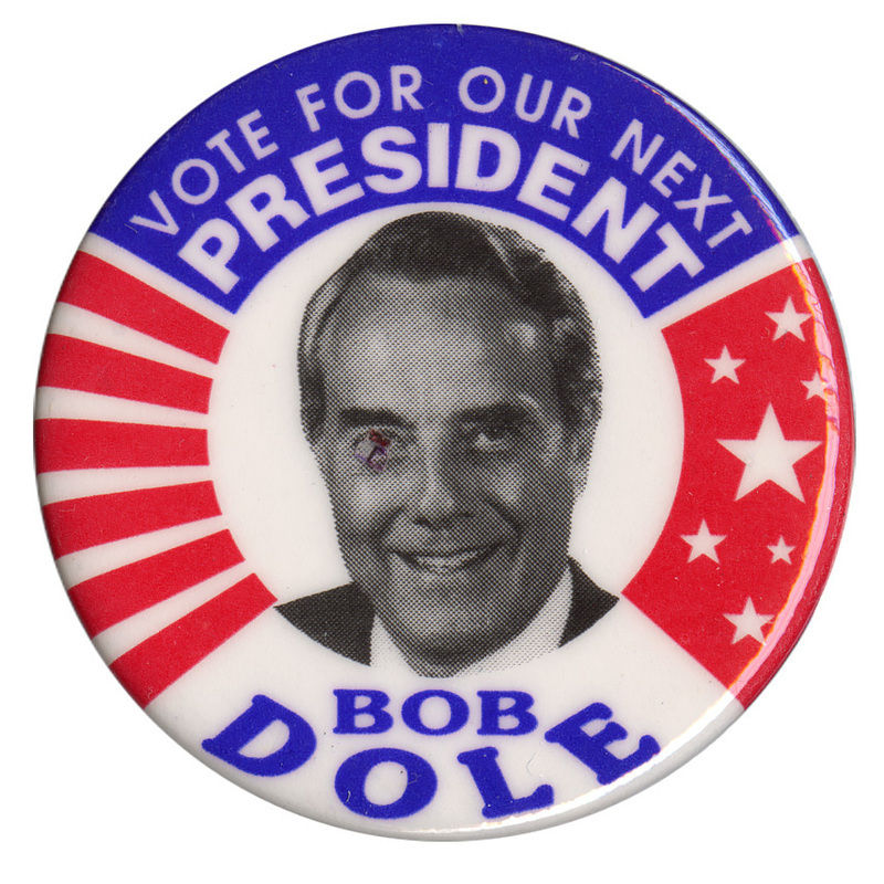 Round button with red, white, and blue stars and stripes. In the center is a black and white photograph of Bob Dole. White and blue text reads "VOTE FOR OUR NEXT PRESIDENT BOB DOLE"