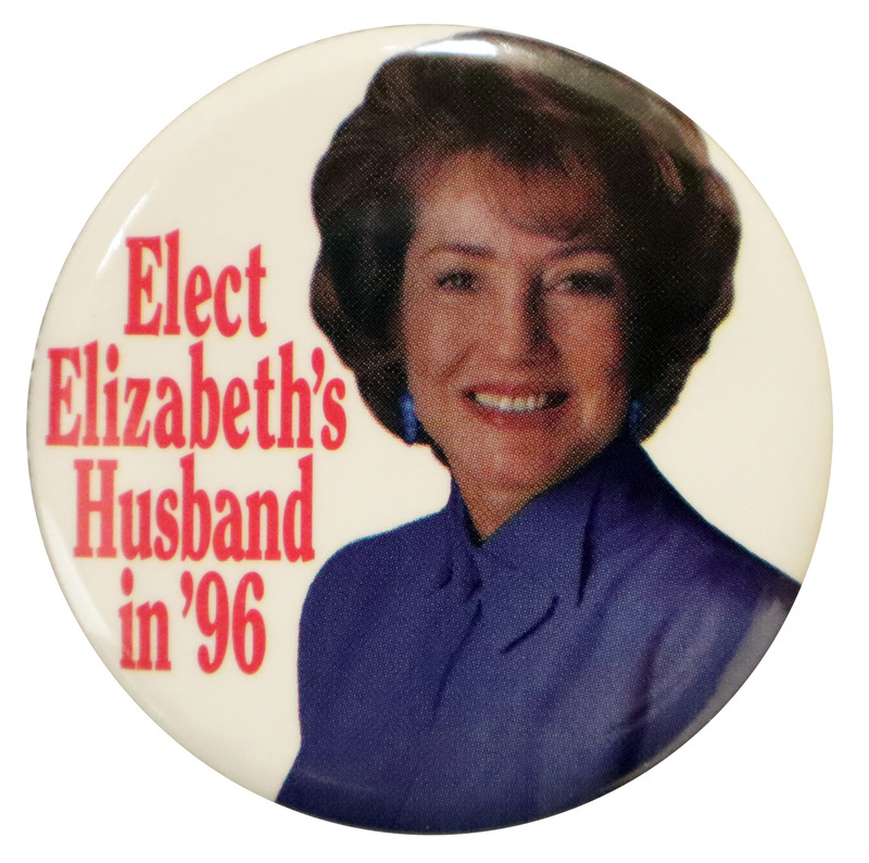 Round, white button with a color photograph of Elizabeth Dole. Red text reads "Elect Elizabeth's Husband in '96"