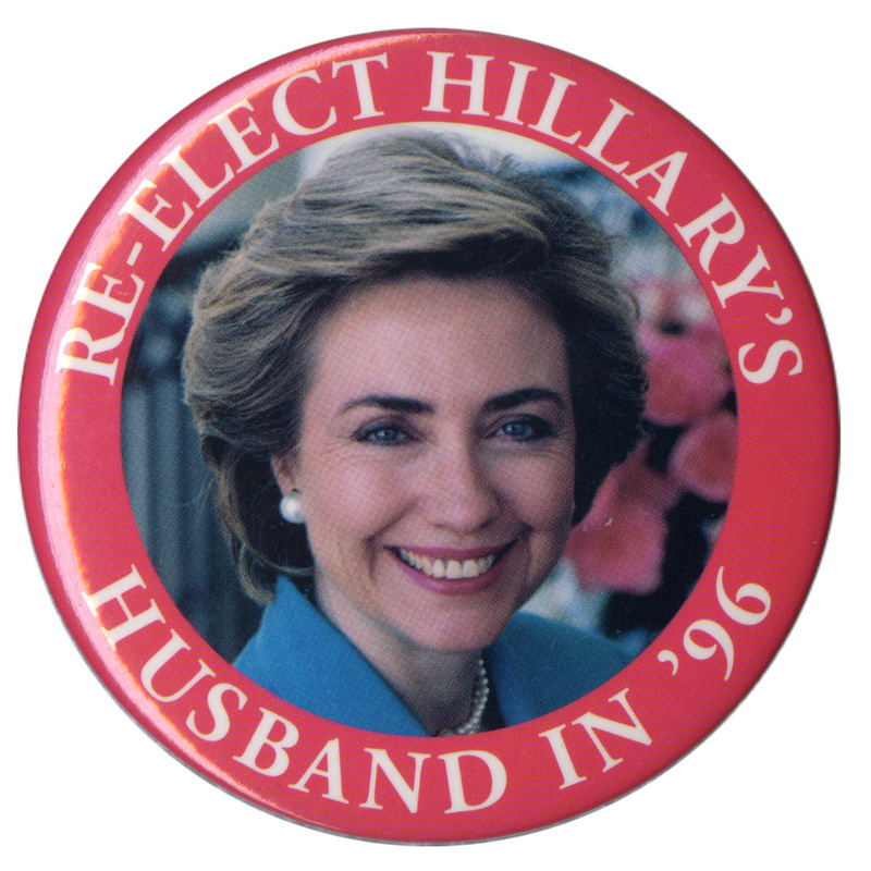 Round button with a red border and a color photograph of Hillary Clinton. White text around the edge reads "RE-ELECT HILLARY'S HUSBAND IN '96"