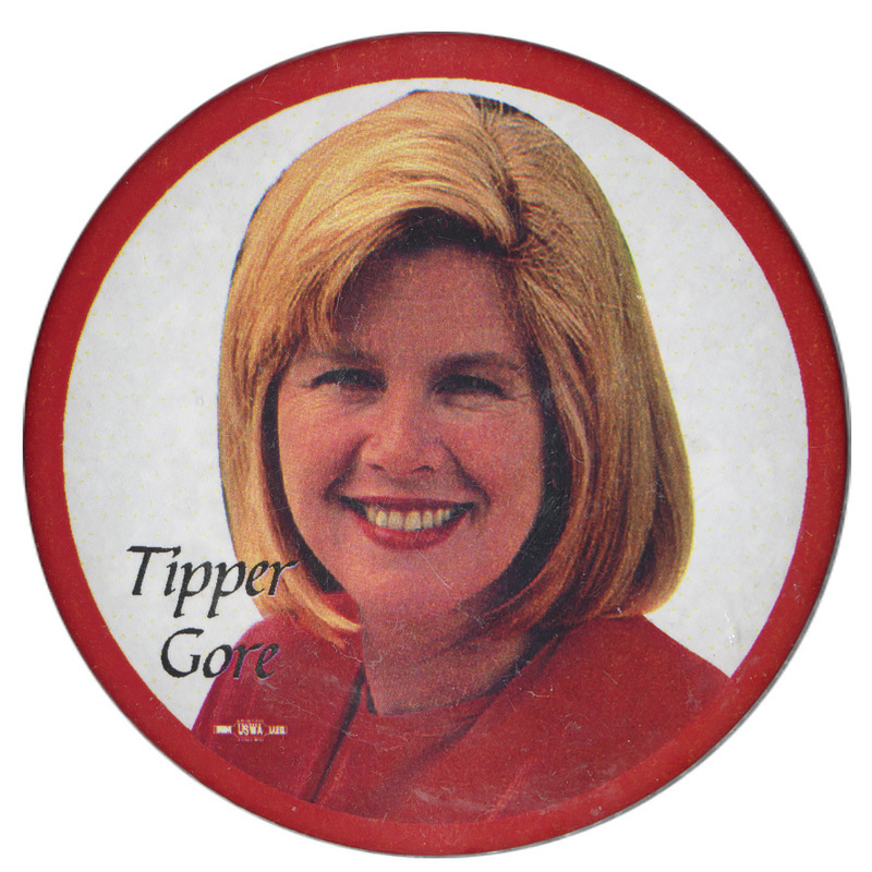 Round button with a red border and a color photograph of Tipper Gore. Red text reads "Tipper Gore."