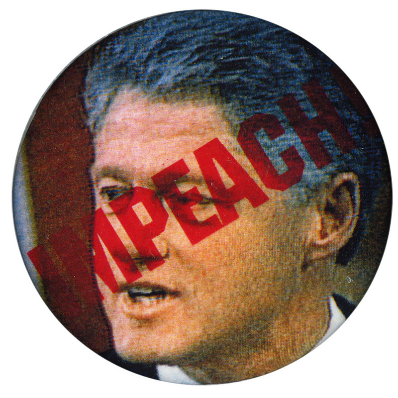 Round button with a color photograph of Bill Clinton. Red text across Clinton's face reads "IMPEACH"