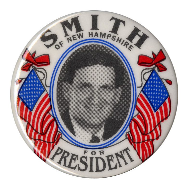 Round, white button with a black and white photograph of Bob Smith surrounded by illustrations of US flags and red ribbons. Black text reads "SMITH OF NEW HAMPSHIRE FOR PRESIDENT"