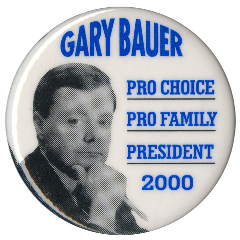 Round, white button with a black and white photograph of Gary Bauer. Blue text reads "GARY BAUER PRO CHOICE PRO FAMILY PRESIDENT 2000"