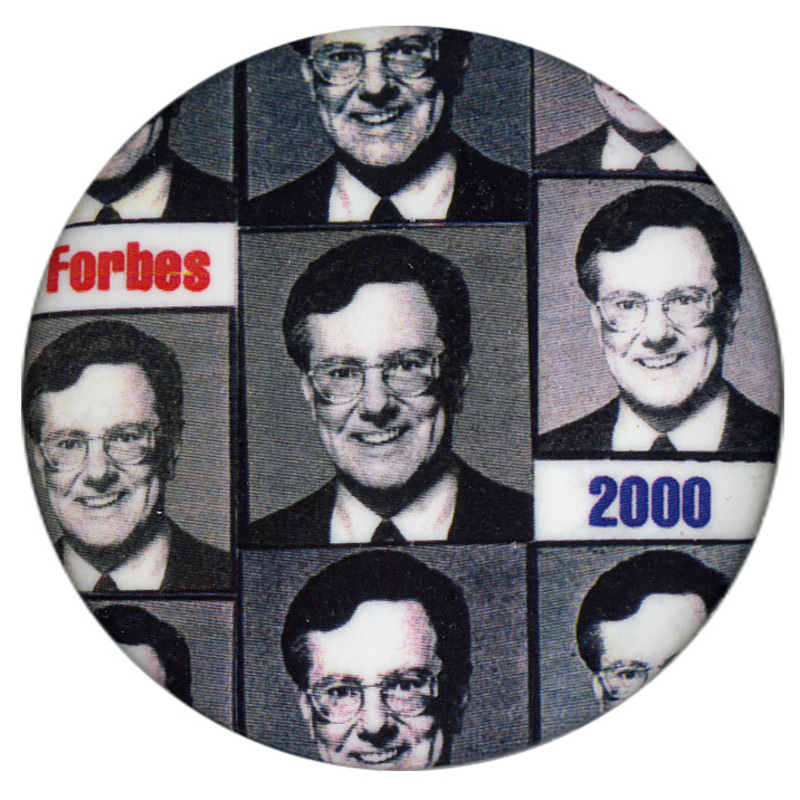 Round button with a repeated pattern of black and white photographs of Steve Forbes. Red and blue text reads "Forbes 2000"