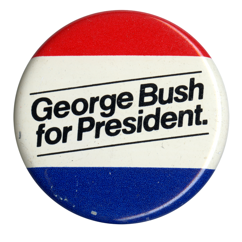Round button with horizontal bands of red, white, and blue. Black text reads "George Bush for President."