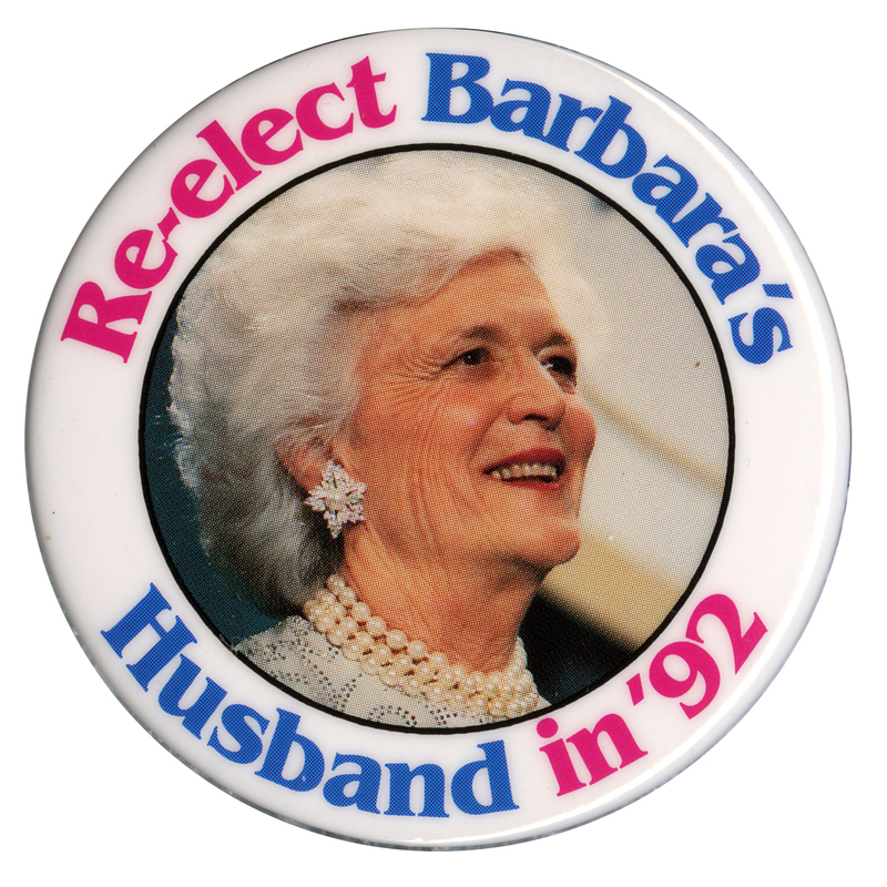 Round button with a white border and a color photograph of Barbara Bush in the center. Pink and blue text reads "Re-elect Barbara's Husband in '92"