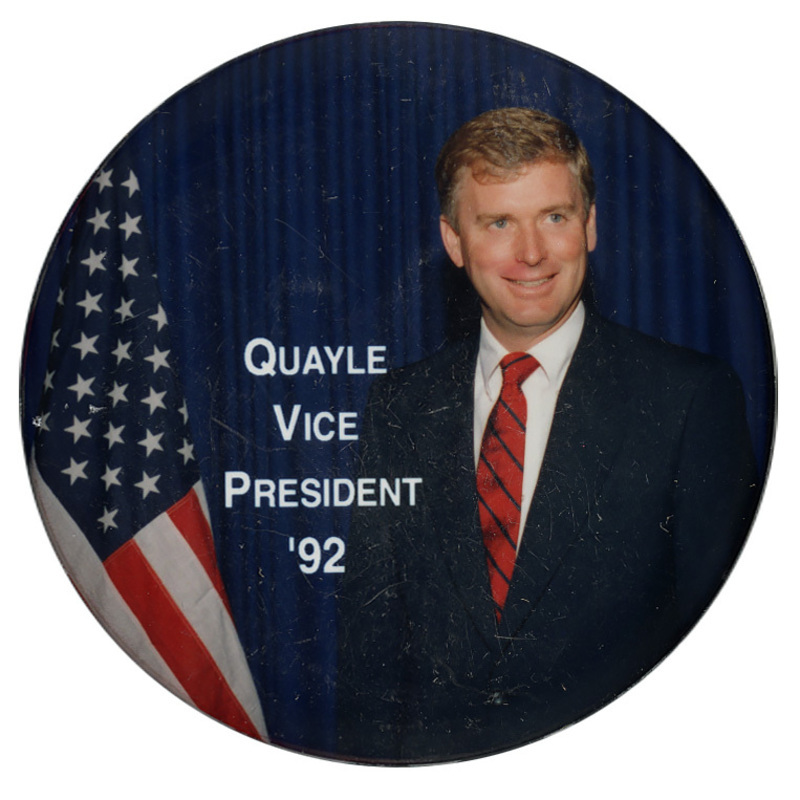 Round button with a color photograph of Dan Quayle standing next to a US flag. White text reads "QUAYLE VICE PRESIDENT '92"