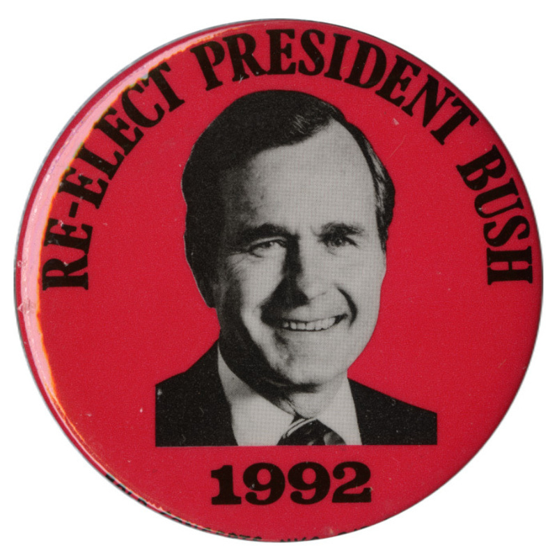 Round, red button with a black and white photograph of George H. W. Bush and black text reading "RE-ELECT PRESIDENT BUSH 1992"