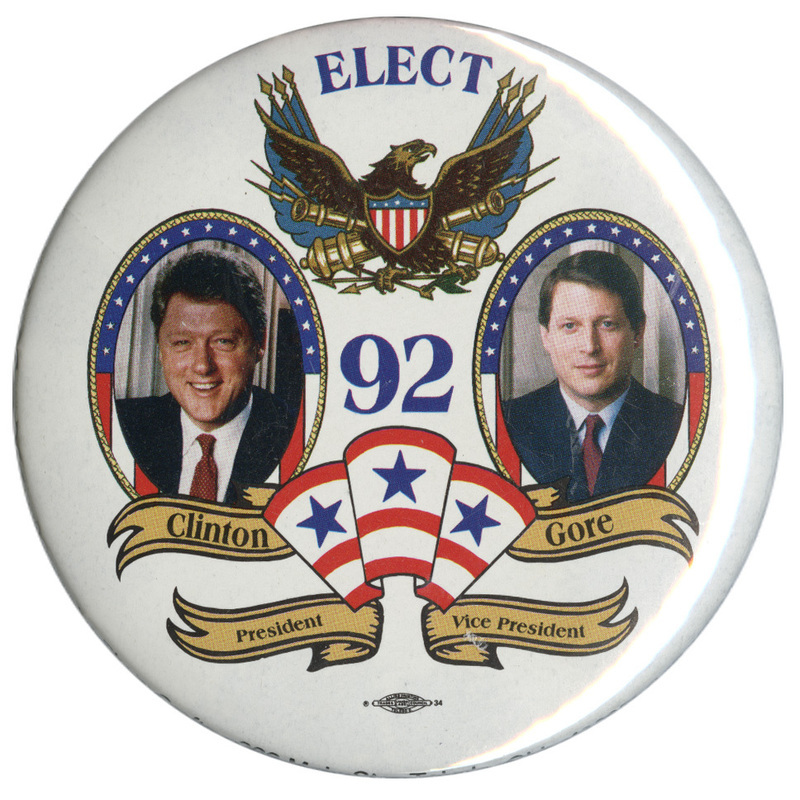 Round, white button with color photographs of Bill Clinton in flag-themed frames below a color drawing of an eagle, cannons, spears, and flags. Text reads "ELECT 92 CLINTON GORE President Vice President"