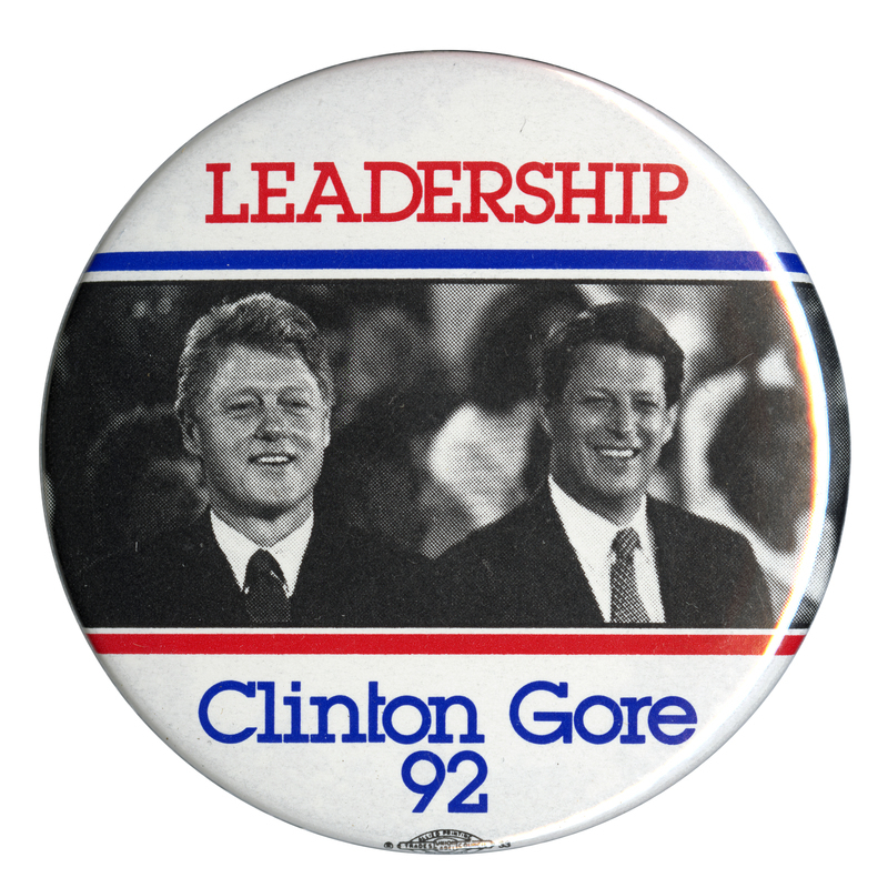 Round, white button with a black and white photograph of Bill Clinton and Al Gore across the middle. Red and blue text reads "LEADERSHIP Clinton Gore 92"