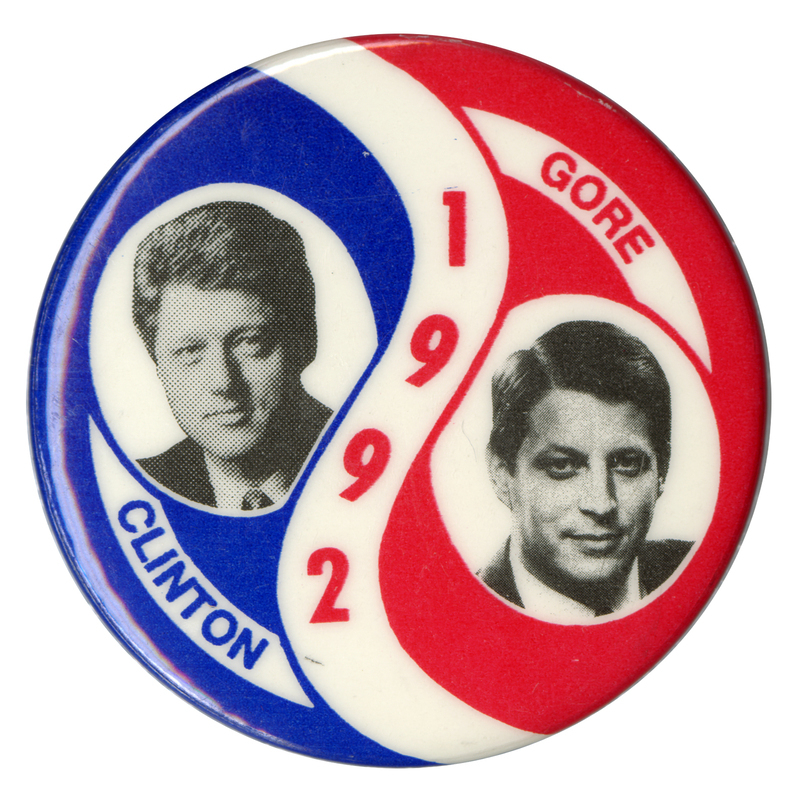 Round, red, white, and blue button with curving stripes. Black and white photographs of Bill Clinton and Al Gore appear on the left and right. Blue and red text reads "1992 CLINTON GORE"